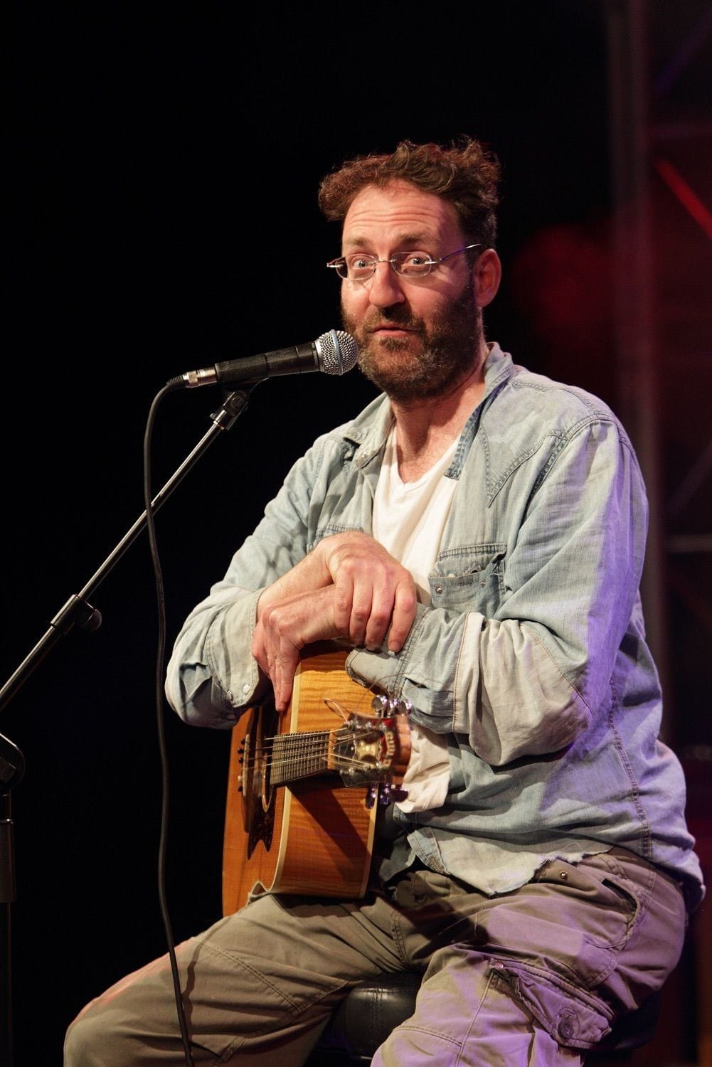 A comedien sings and plays guitar at the Vodafone Comedy Festival which was held in the Iveagh Gardens, Dublin, Ireland