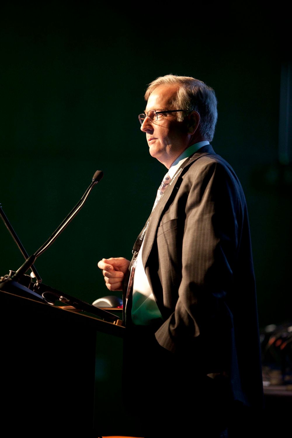 A speaker photographed fro the side of the stage