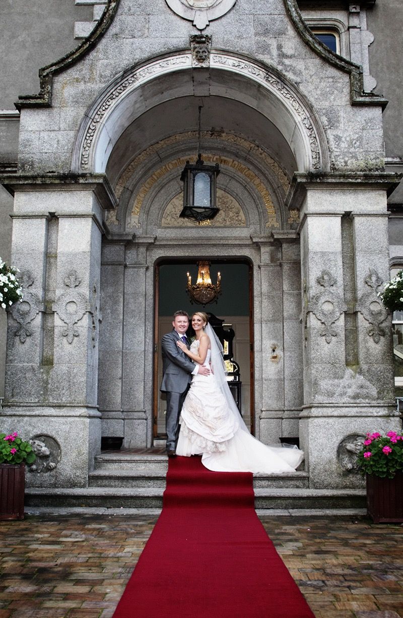 The bride and groom standing in the doorway of the Killashee Hotel, Naas, Co Kildare