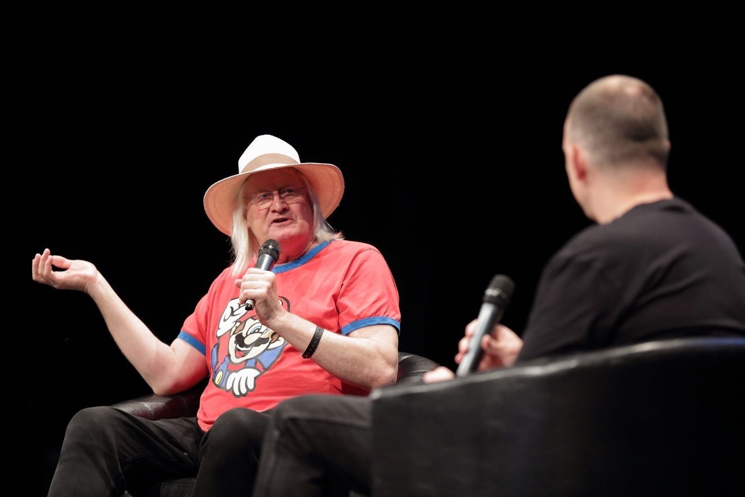 A creator is interviewed on stage live at Comicon, held in the Conference Centre Dublin