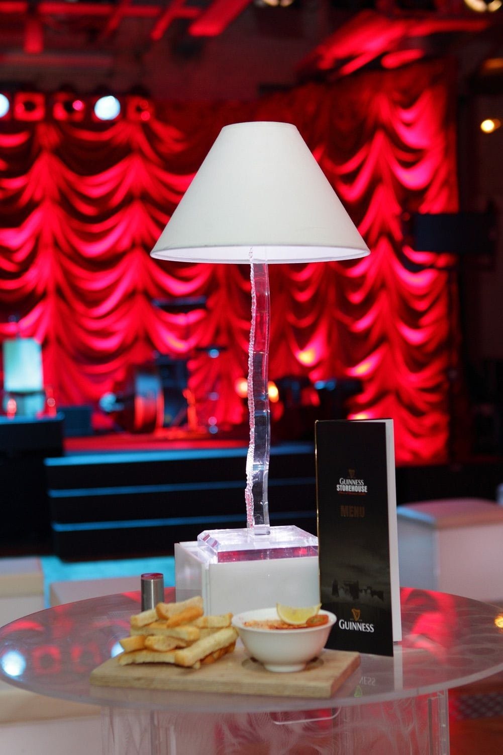 A photograph of a lamp and finger food before an party in teh Arrol Suite, in the Guinness Storehouse, Dublin