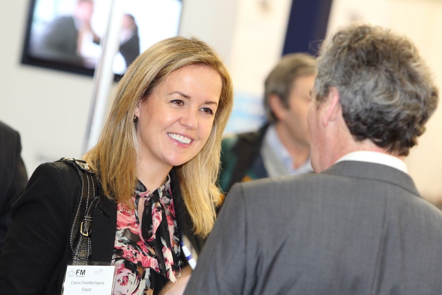 Delegates chat at an exhibition in the RDS main hall, Dublin