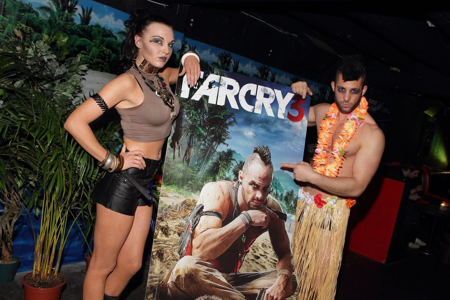 Models pose with promotional banner at the Far Cry 3 launch event in Dublin, Ireland