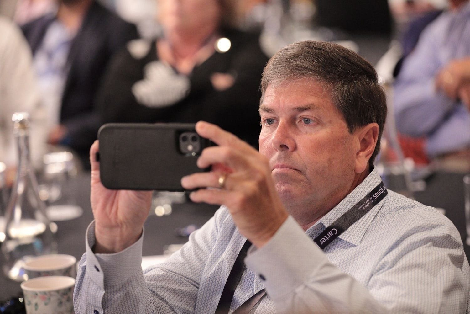 One of the delegates takes a photograph of the screen during the conference in the Conrad Hotel, Dublin