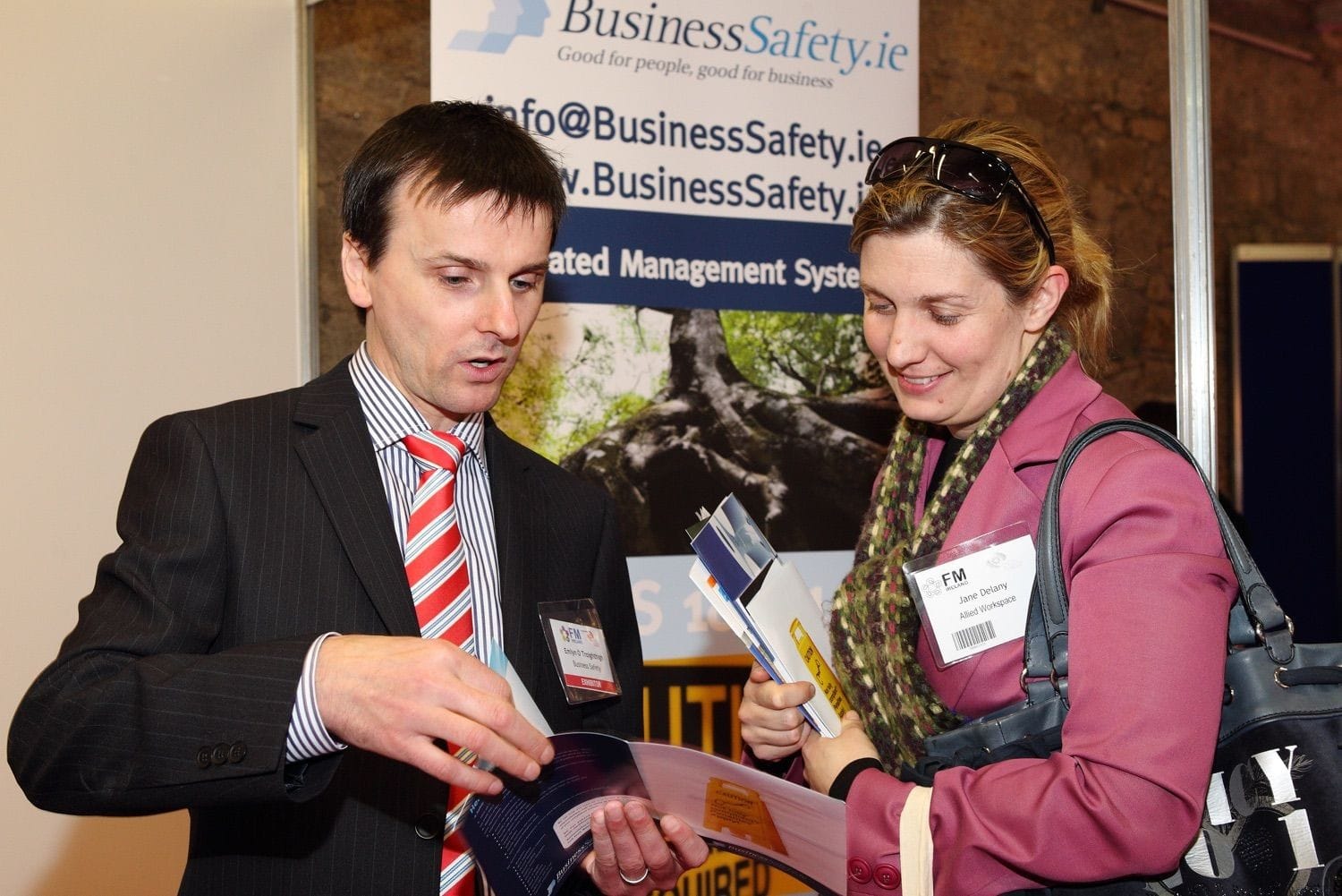 A customer has the range of products explained at the Facilities Management shot in the Industries Hall of the RDS, Dublin