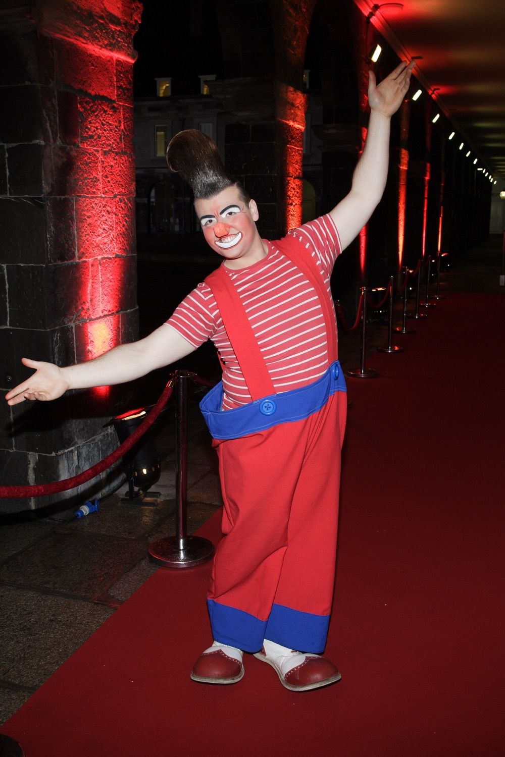 A clown welcomes guests to a corporate Christmas party in the Royal Hospital, Kilmainham