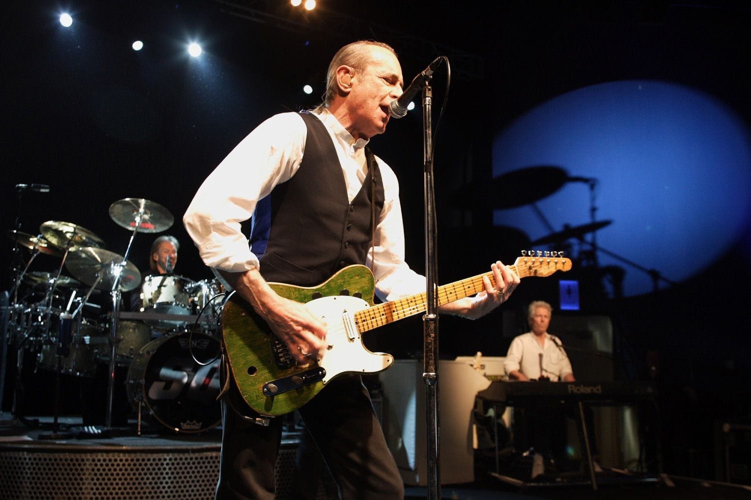 Francis Rossi onstage with the other members of Status Quo at a private 50th birthday party in the Round room of the Mansion House, Dublin