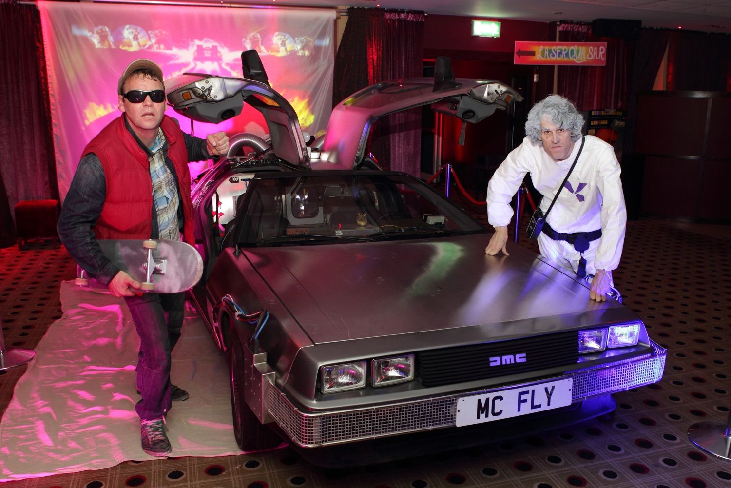 Marty McFly and Doc characters and themed decor for a Back to the Future corporathe Future corporate event