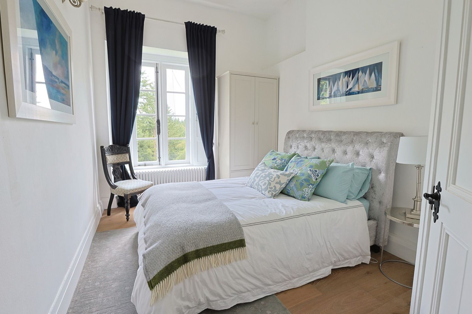 A nautical theme in the second bedroom overlooking the woods surrounding the castle