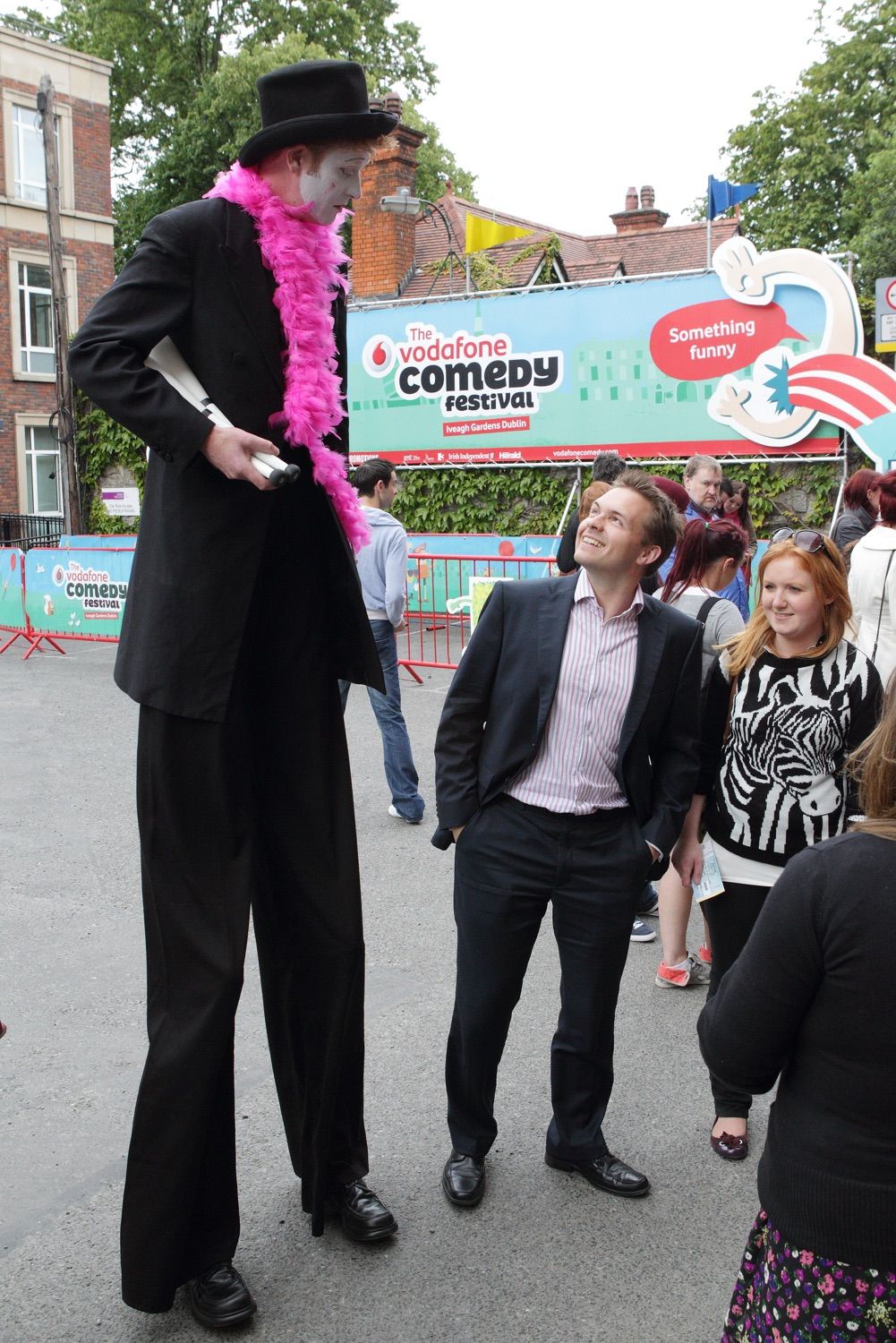 A stilt walker interacts with guests at the Vodafone Comedy Festival which was held in the Iveagh Gardens, Dublin, Ireland