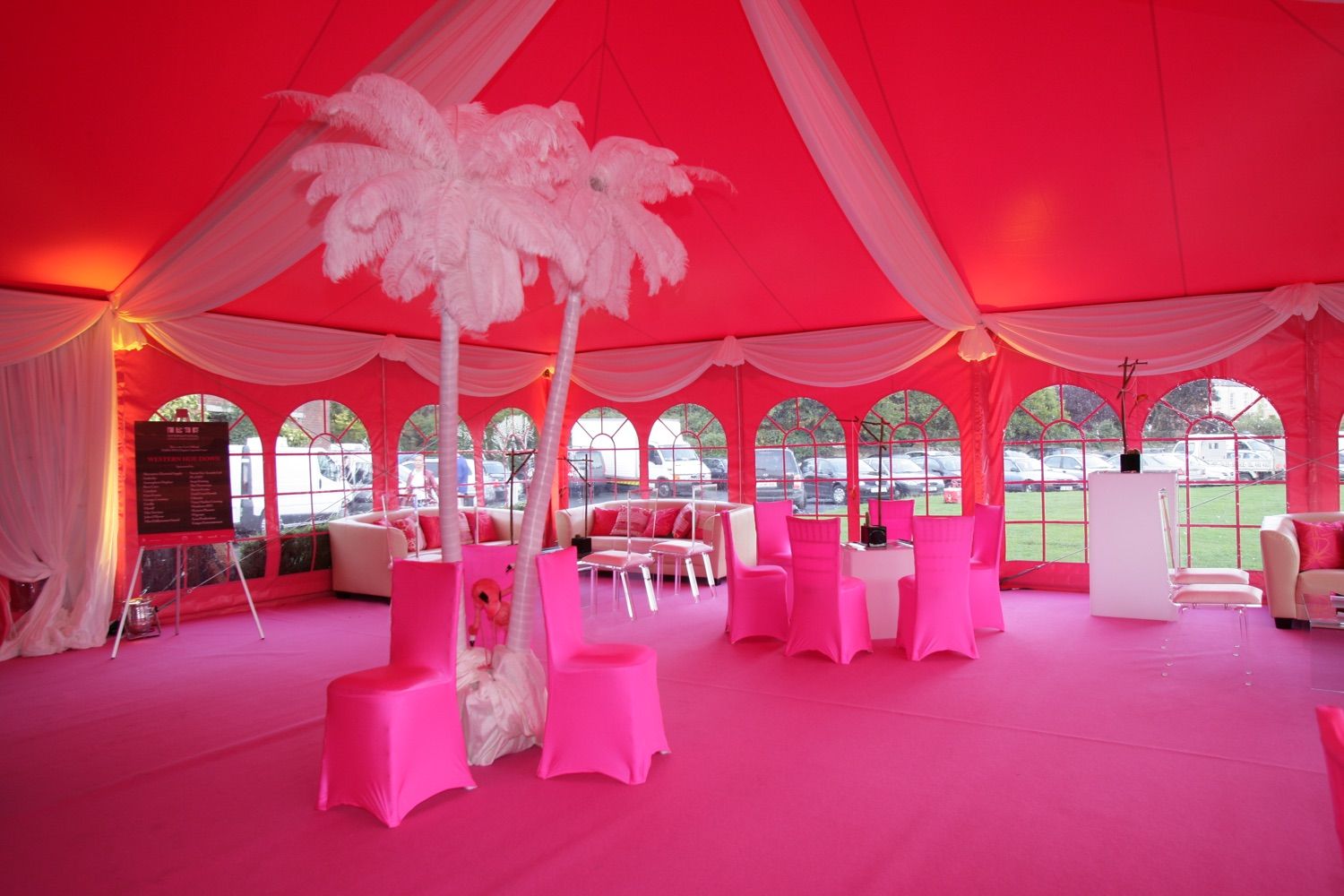 Pink decor in a large marquee for a multi zone corporate party at Pembroke Cricket Club, Ballsbridge, Dublin