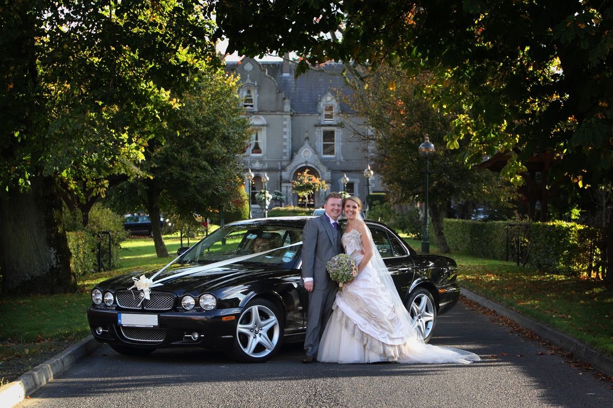 The bride and groom on the driveway of the Killashee Hotel, Naas, Co Kildare