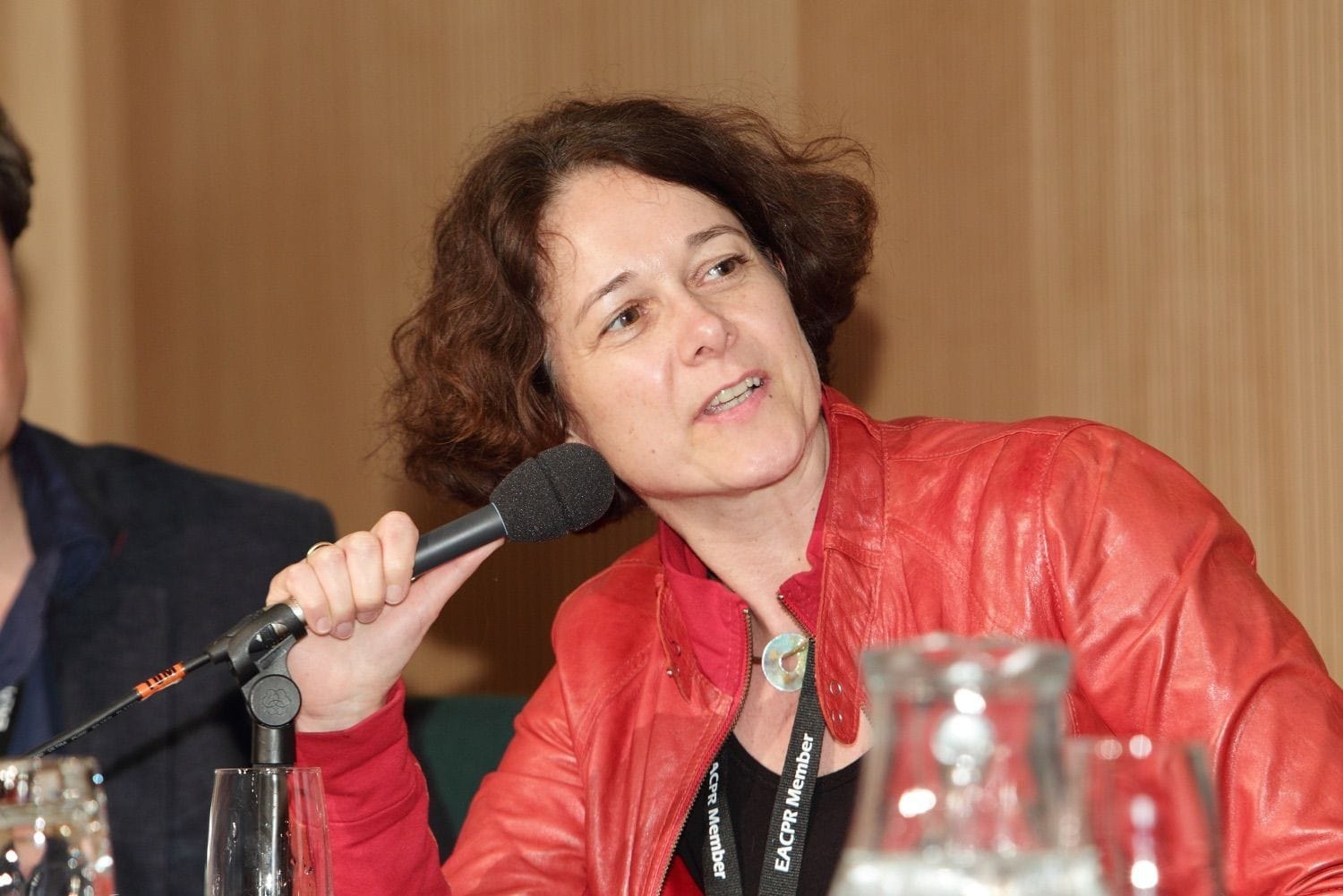 A lady speaker grabs the microphone to respond to a question during the Q&A in the Convention Centre Dublin