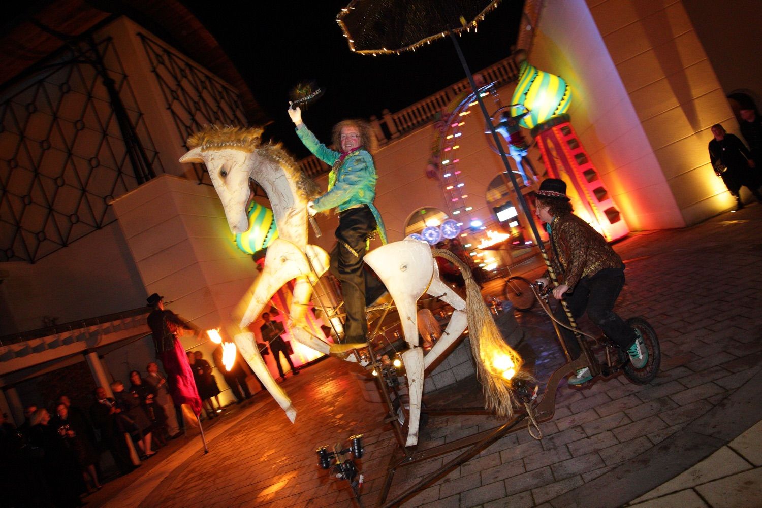 Performers salute the camera from a mechanical horse being ridden in the walled Garden at a corporate party in Powerscourt Hotel and Resport, Wicklow