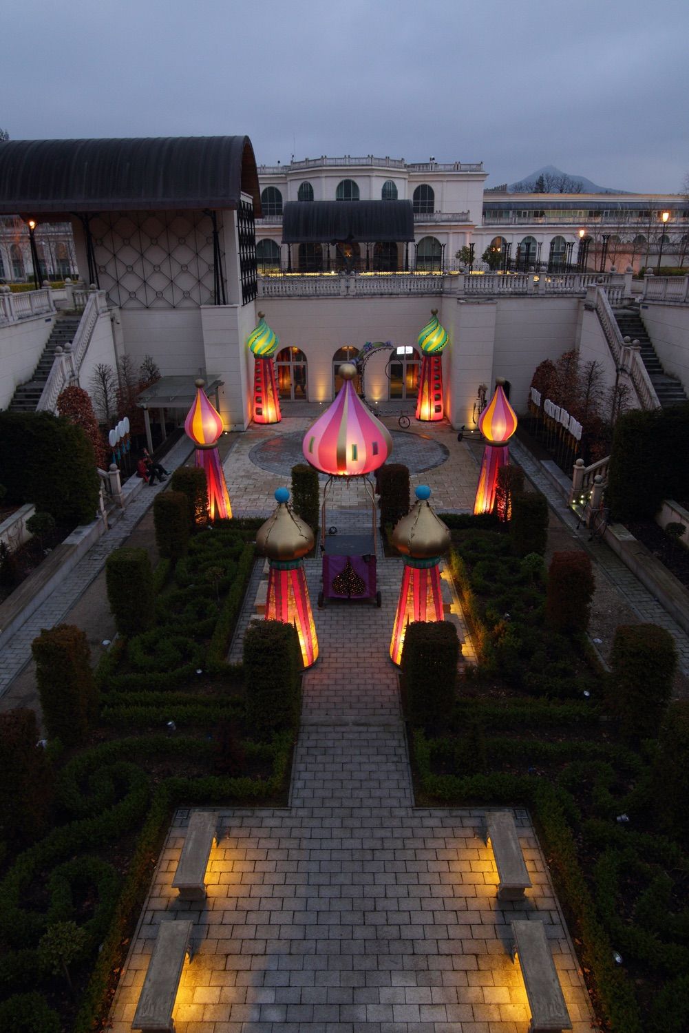 A view down into the walled garden of teh Powerscourt Hotel , county Wicklow, showing the set up for a lit up carnival performance during the drinks reception