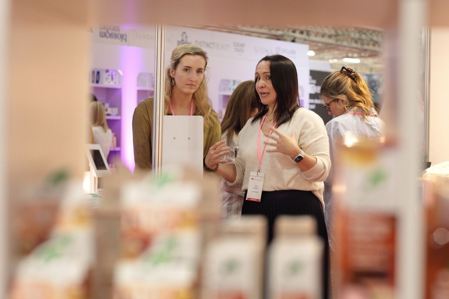 A staff memnber helps a customer with some advice during a trade show/exhibition in the RDS main hall, Dublin