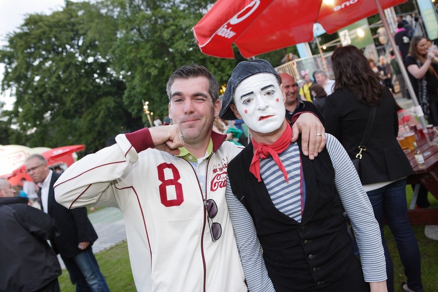 A guy pretends to punch a mime at the Vodafone Comedy Festival which was held in the Iveagh Gardens, Dublin, Ireland