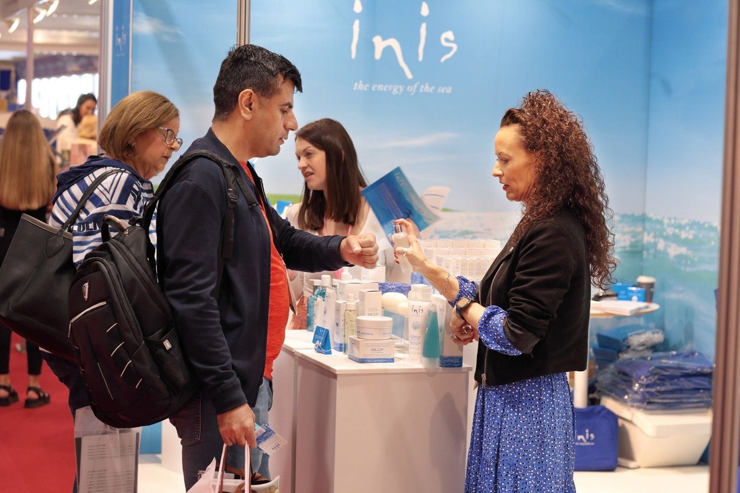 A customer gets a product sample at a show in the Main Hall of the RDS, Dublin