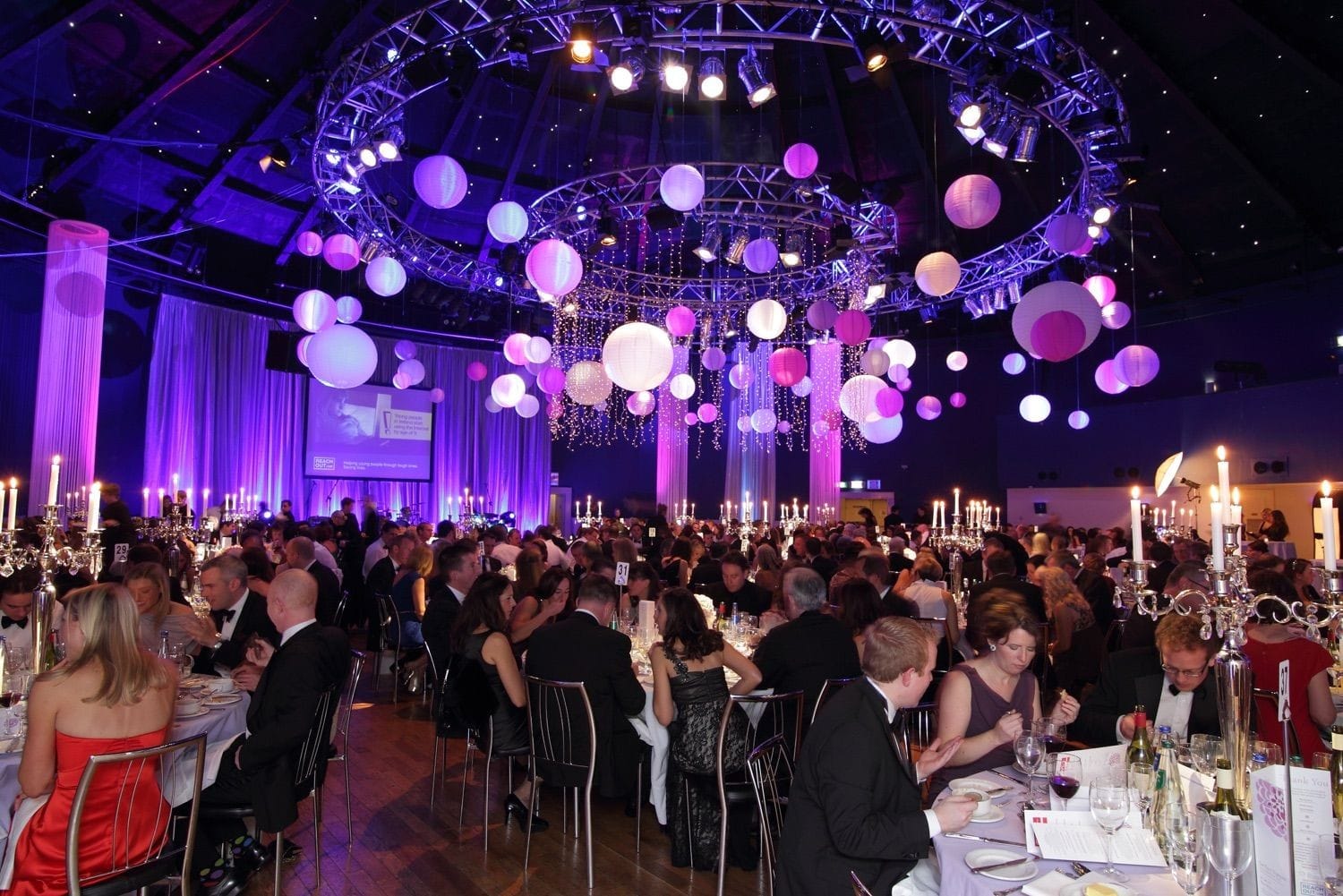 A wide shot of the Round room in the Mansion House, Dublin, during dinner, to show the stage, lighting and decoreations