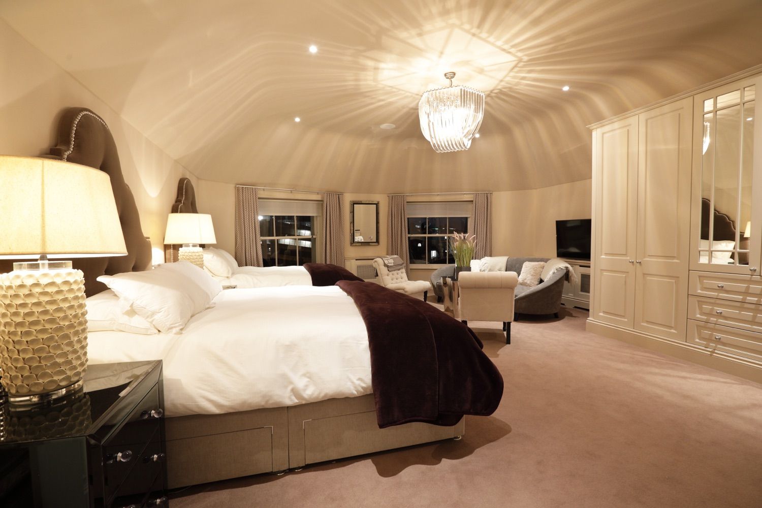 Two double beds, lounge area art deco lighting and a hidden en suite. What more can you ask for