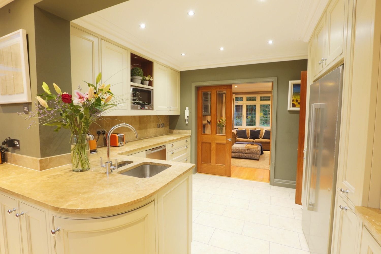 The main kitchen with access into the kids TV room