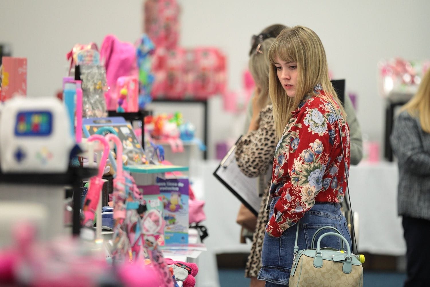 A young lady looks at the products at an industry trade show in the RDS main hall, Dublin