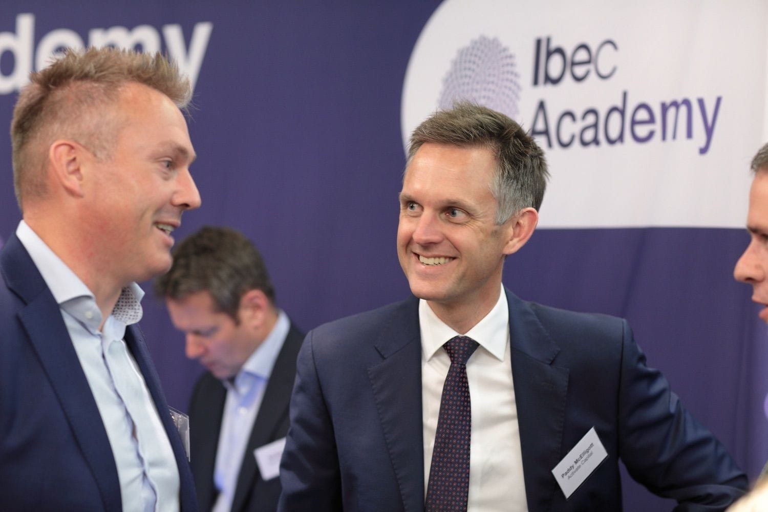 A deegate chats to staff at the IBEC Academy stand in the exhibition space at a conference in the convention Centre Dublin