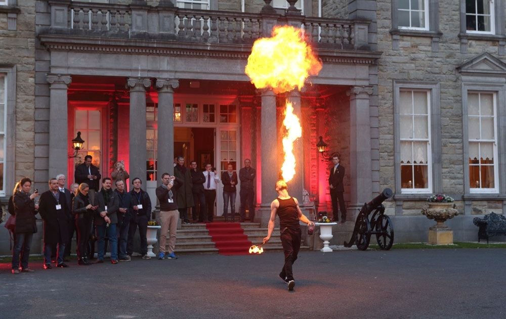 A firebreather spits fire above his head at a corporate event at Johnstown House, Naas, Co Kildare