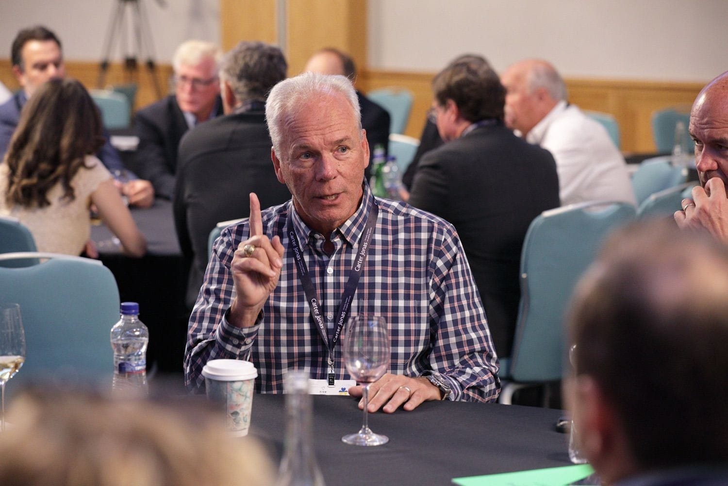 A male delegate raises his finger during a group discussion in the Conrad Hotel, Dublin