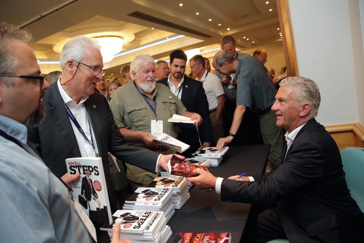 An motivational speaker, who lost his legs in an accident signs copies for the delegates after his presentation at the conference in the Conrad Hotel, Dublin