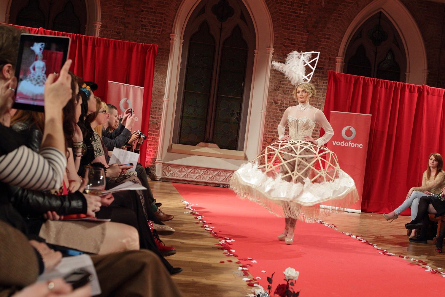 A model walks down the catwalk wearing a creative design at the Smock Alley Theatre, Dublin